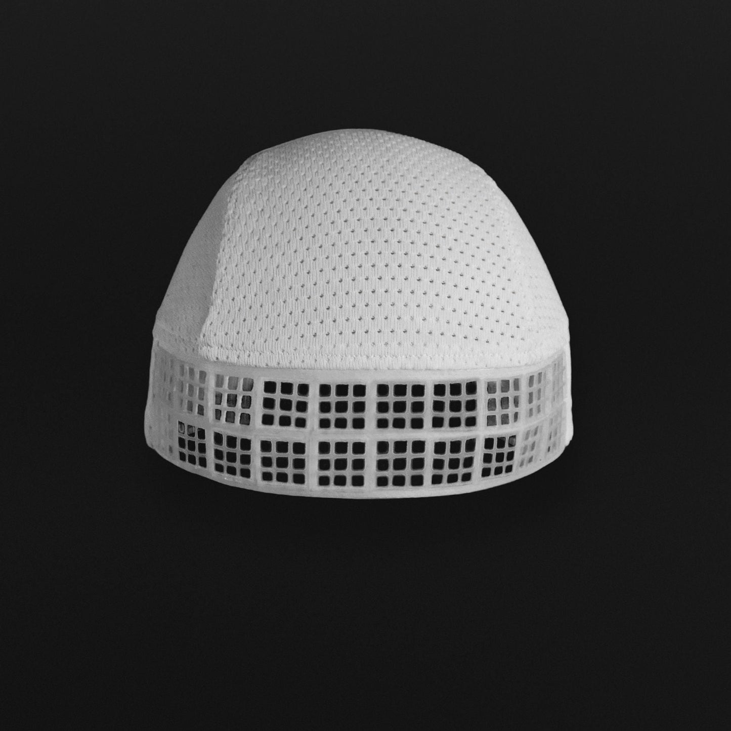 White Omius cooling reverse cap on a black background.